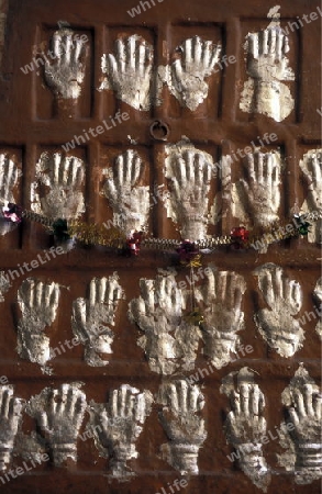 Women Handprints at teh entry to the Fort of the city of  Jodhpur in the province of Rajasthan in India.