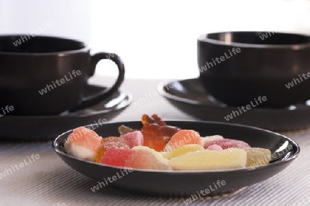 black cups and sweets