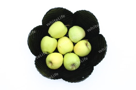 a black fruit bowl with green apples    eine schwarze Obstschale,mit gr?nen ?pfelnow