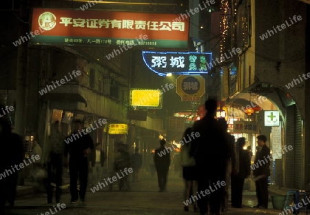  the Market streets at night of Chongqing in the province of Sichuan in china in east asia. 