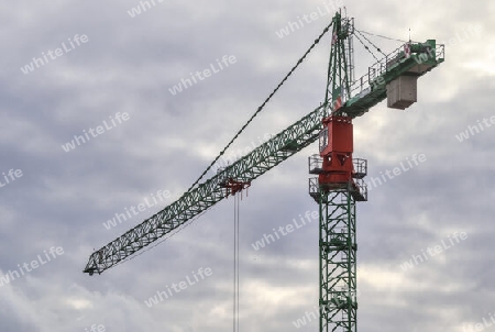 Several cranes on constructions sites at high buildings all over Europe.