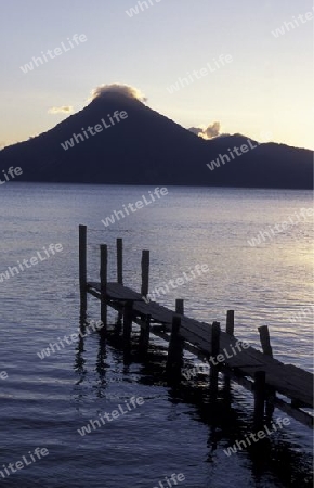 The Lake Atitlan mit the Volcanos of Toliman and San Pedro in the back at the Town of Panajachel in Guatemala in central America.   