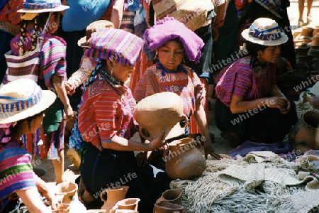 people in traditional clotes in the Village of  San Cristobal in Guatemala in central America.   