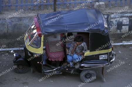 a Tuck Tuck Taxi in the city of Ahmedabad in the province Gujarat in India.