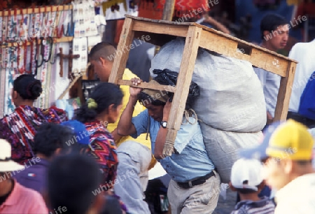 people in traditional clotes at the Market in the Village of  Chichi or Chichicastenango in Guatemala in central America.   