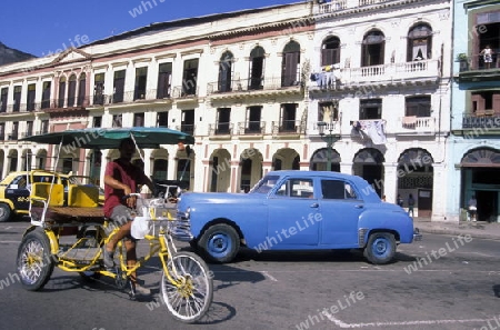 old cars in the old townl of the city of Havana on Cuba in the caribbean sea.