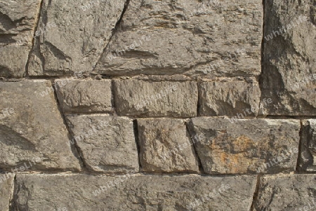 eine Mauer aus graue, verwitterten Sandstein mit gebrochener Oberfl?che