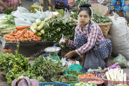 a women at a Food market in the City of Mandalay in Myanmar in Southeastasia.
