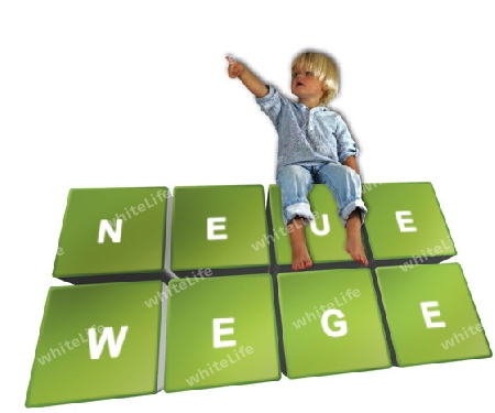 Little blonde boy sitting on game pads labeled 'Neue Wege'