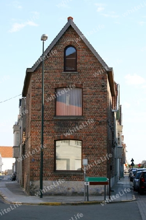 The gable of a house built of bricks  Der Giebel eines  aus Klinkern gebauten Hauses