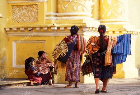indio women at the church senora de la nerced in the old town in the city of Antigua in Guatemala in central America.   