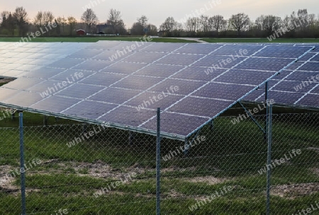 Generating clean energy with solar modules in a big park in northern Europe.