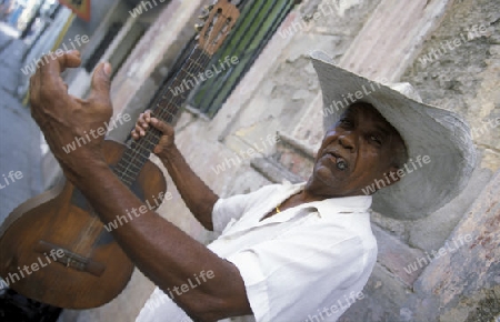 a Salsa Music Band on the Parce Cespedes in the city of Santiago de Cuba on Cuba in the caribbean sea.