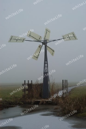 small windmill in fog
