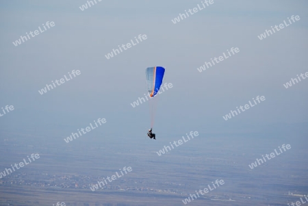 Man with a hang glider