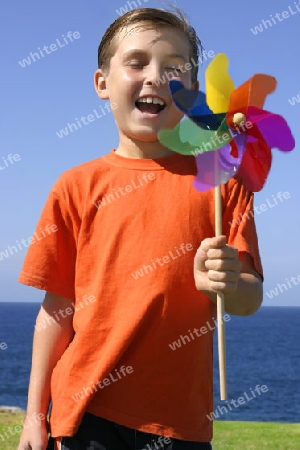 Boy holding a pinwheel