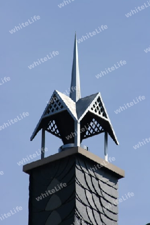 beautiful ornate chimney hood, with blue sky in the background  sch?ne verzierte Schornsteinhaube,mit blauem Himmel im Hintergrund