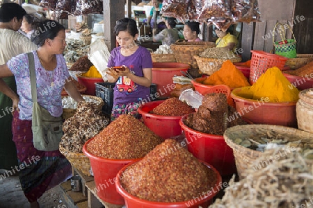 a curry shop at a marketstreet in the City of Mandalay in Myanmar in Southeastasia.