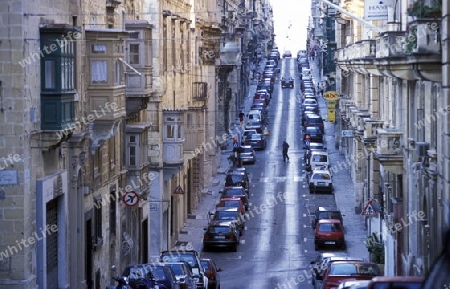 A smal road in the centre of the Old Town of the city of Valletta on the Island of Malta in the Mediterranean Sea in Europe.
