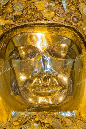 The Mahamuni Buddha at the Mahamuni temple in the City of Mandalay in Myanmar in Southeastasia.