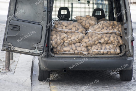 a potato transport in the old town of  ribeira in the city centre of Porto in Porugal in Europe.