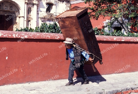 a men works in the old town in the city of Antigua in Guatemala in central America.   