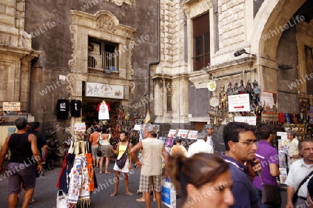 shops in the streets in the old Town of Catania in Sicily in south Italy in Europe.
