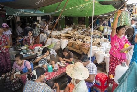 a restaurant and fish market at a marketstreet in the City of Mandalay in Myanmar in Southeastasia.