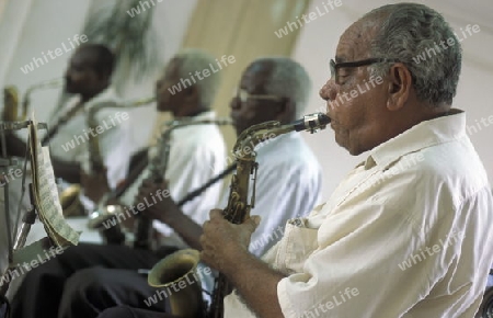 a Salsa Music Band on the Parce Cespedes in the city of Santiago de Cuba on Cuba in the caribbean sea.