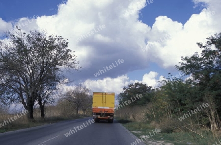 a hightway with a truck outside of the city of Sofia in Bulgaria in east Europe.