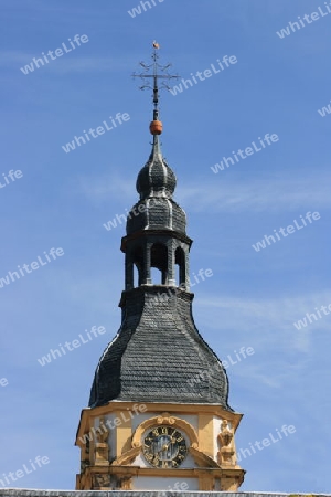 Church tower with a beautiful clock, and blue sky in the background    Kirchturm mit einer sch?nen Uhr,und blauem Himmel im Hintergrund 