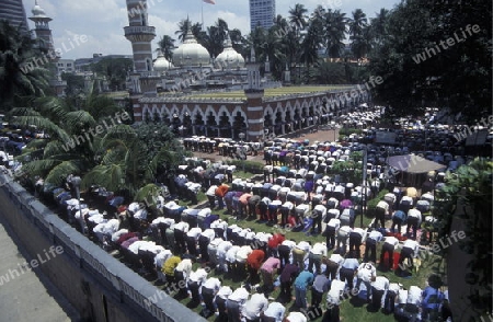 Muslim prayers at a Mosque in the city of  Kuala Lumpur in Malaysia in southeastasia.