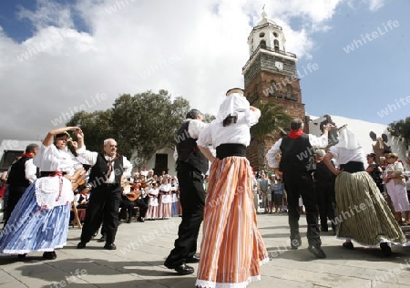 a traditional Dance in the old town of Teguise on the Island of Lanzarote on the Canary Islands of Spain in the Atlantic Ocean. on the Island of Lanzarote on the Canary Islands of Spain in the Atlantic Ocean.
