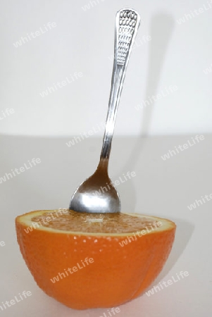Orange  fruit with spoon