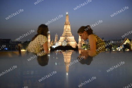 Tourists near the Wat Arun during a rally at theDemocracy Monument in .Bangkok, Thailand, Saturday Jan.11 , 2014.
