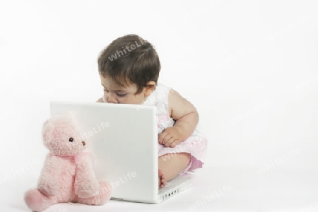Stock Photo:  Baby Girl at Laptop Computer