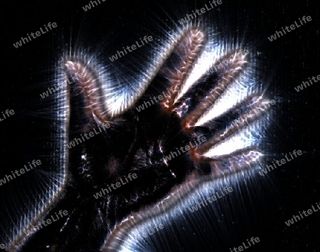 3D-Illustration of a glowing human female hand with a kirlian aura showing different symbols.