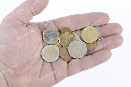 Euro Muenzen , Kleingeld in einer Hand
