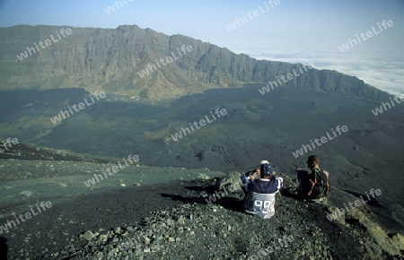 Tourists on the top of the Fogo Village on the Volcano Fogo on the Island Fogo on Cape Verde in the Atlantic Ocean in Africa.