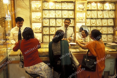 a Gold shop the souq or Market in the old town in the city of Dubai in the Arab Emirates in the Gulf of Arabia.