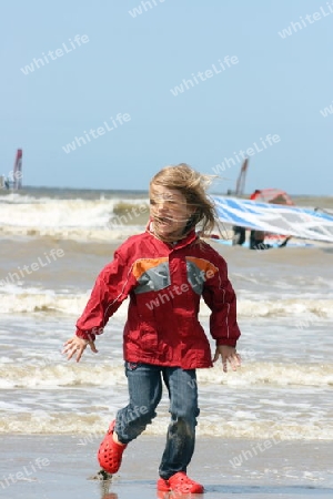 a blonde girl on stormy beach  