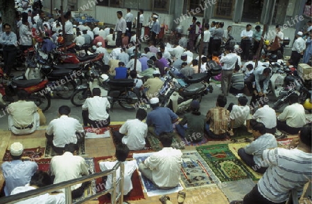 Muslim prayers at a Mosque in the city of  Kuala Lumpur in Malaysia in southeastasia.