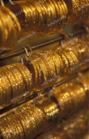 a Gold shop the souq or Market in the old town in the city of Dubai in the Arab Emirates in the Gulf of Arabia.