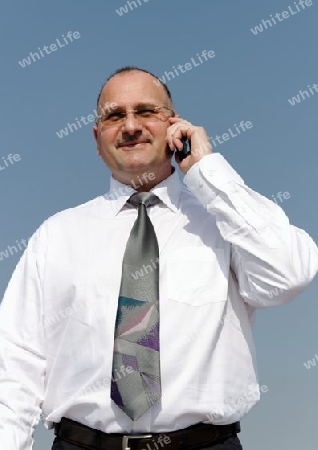 smart businessman calling with cellphone
