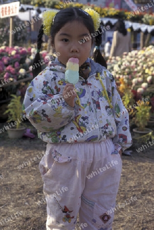 a girl with a icecream in the city of Nanchang in the provinz Jiangxi in central China.