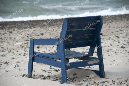  Stranded chair on the beach in Denmark