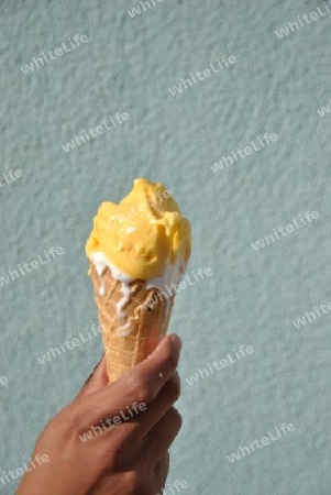 icecream melting down in a lass  hand