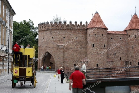 The old Citywall und Barbakane in the old Town in the City of Warsaw in Poland.