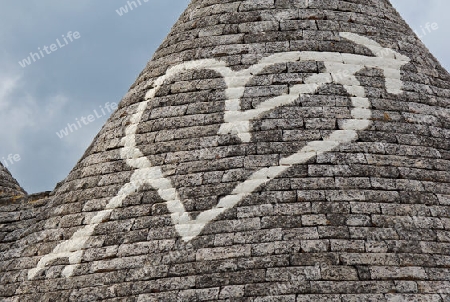 Symbolzeichen auf einem Trullodach in Alberobello / Apulien