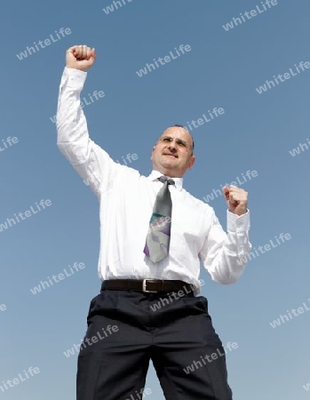 happy businessman is jumping outdoor
